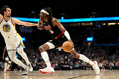Dec 17, 2023; Portland, Oregon, USA; Portland Trail Blazers small forward Jerami Grant (9) dribbles the ball while defended by Golden State Warriors power forward Dario Saric (20) during the second half at Moda Center. Mandatory Credit: Soobum Im-Imagn Images