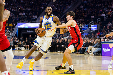 Dec 5, 2024; San Francisco, California, USA;  Houston Rockets guard Reed Sheppard (15) defends against Golden State Warriors forward Andrew Wiggins (22) during the first quarter at Chase Center. Mandatory Credit: John Hefti-Imagn Images