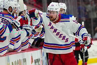 May 11, 2024; Raleigh, North Carolina, USA; New York Rangers left wing Alexis Lafrenière (13) celebrates after scoring a goal against the Carolina Hurricanes during the third period in game four of the second round of the 2024 Stanley Cup Playoffs at PNC Arena. Mandatory Credit: James Guillory-USA TODAY Sports