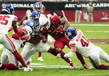 Arizona Cardinals running back James Conner (6) is tackled by New York Giants linebacker Micah McFadden (41) in the fourth quarter at State Farm Stadium in Glendale