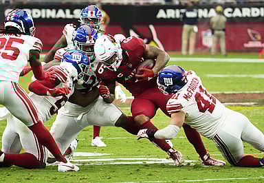 Arizona Cardinals running back James Conner (6) is tackled by New York Giants linebacker Micah McFadden (41) in the fourth quarter at State Farm Stadium in Glendale