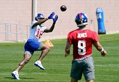 New York Giants quarterback Daniel Jones (8) throws to wide receiver Darren Waller (12) during organized team activities (OTA's) at the Giants training center on Wednesday, May 31, 2023, in East Rutherford.