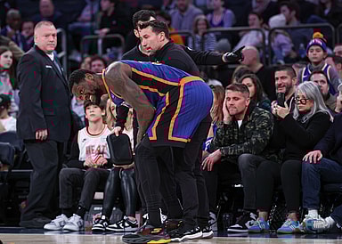 New York Knicks forward Julius Randle (30) is helped by medical staff after an injury during the second half against the Miami Heat at Madison Square Garden