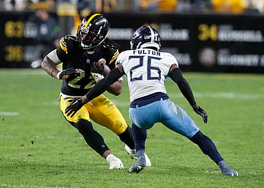 Pittsburgh Steelers running back Najee Harris (22) runs against Tennessee Titans cornerback Kristian Fulton (26) (New York Giants target) during the third quarter at Acrisure Stadium