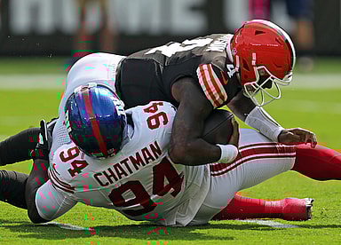 Cleveland Browns quarterback Deshaun Watson (4) is sacked by /New York Giants defensive tackle Elijah Chatman (94) during the first half of an NFL football game at Huntington Bank Field, Sunday, Sept. 22, 2024, in Cleveland, Ohio.