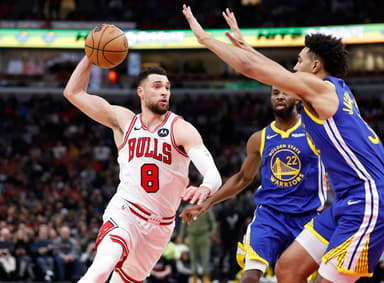 Jan 12, 2024; Chicago, Illinois, USA; Chicago Bulls guard Zach LaVine (8) drives against Golden State Warriors forward Trayce Jackson-Davis (32) during the second half at United Center. Mandatory Credit: Kamil Krzaczynski-Imagn Images