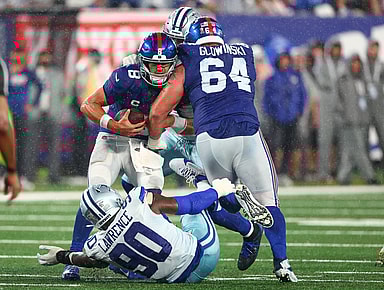 New York Giants quarterback Daniel Jones (8) is sacked by Dallas Cowboys defensive end DeMarcus Lawrence (90) during the second half at MetLife Stadium, Mark Glowinski