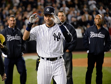 New York Yankees shortstop Derek Jeter (2) reacts with Jorge Posada, Andy Pettitte, and Mariano Rivera after defeating the Baltimore Orioles at Yankee Stadium