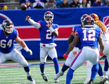 New York Giants quarterback Tyrod Taylor (2) throws complete to tight end Darren Waller (12) against the Commanders at MetLife Stadium