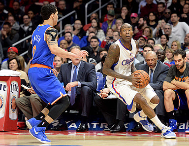 New York Knicks guard Shane Larkin (0) guards Los Angeles Clippers guard Jamal Crawford (11) in the second half of the game at Staples Center