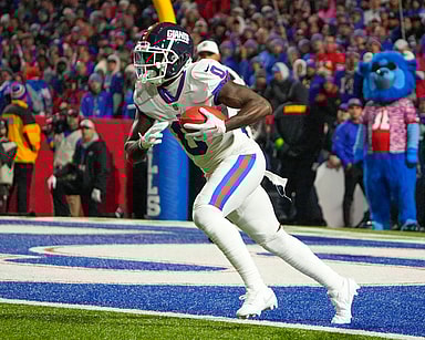 New York Giants wide receiver Parris Campbell (0) runs back a kick off against the Buffalo Bills during the second half at Highmark Stadium