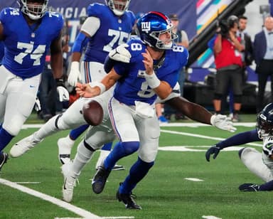 Seattle Seahawks defensive end Mario Edwards Jr. (97) strips the ball from New York Giants quarterback Daniel Jones (8) and the Seahawks recovered at MetLife Stadium