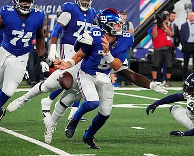 Seattle Seahawks defensive end Mario Edwards Jr. (97) strips the ball from New York Giants quarterback Daniel Jones (8) and the Seahawks recovered at MetLife Stadium