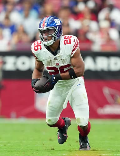 New York Giants running back Saquon Barkley (26) runs against the Arizona Cardinals during the first half at State Farm Stadium