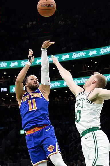 Apr 11, 2024; Boston, Massachusetts, USA;  New York Knicks guard Jalen Brunson (11) shoots the ball past Boston Celtics forward Sam Hauser (30) during the first half at TD Garden. Mandatory Credit: Bob DeChiara-USA TODAY Sports