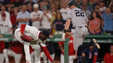Ben Rice reaching first base for the Yankees at Fenway Park