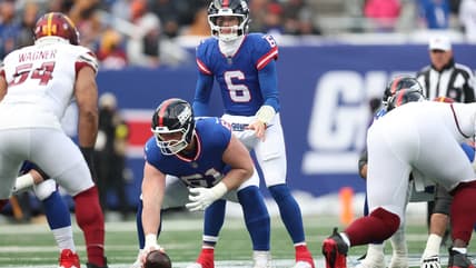 John Michael Schmitz snaps the ball for the Giants