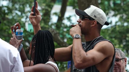 Josh Hart celebrating during a Knicks championship parade