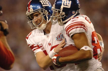 On February 3, 2018, Eli Manning with celebrates David Tyree after a touchdown during Super Bowl XLII Sunday.7xl00loj