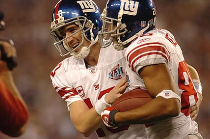 On February 3, 2018, Eli Manning with celebrates David Tyree after a touchdown during Super Bowl XLII Sunday.7xl00loj