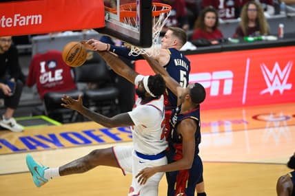 Mitchell Robinson reaches for a rebound for the Knicks against the Cavaliers