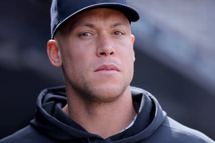 Aaron Judge sits in the Yankees dugout against Cleveland