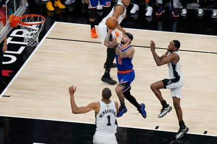 Jose Alvarado celebrating with the Knicks during the parade