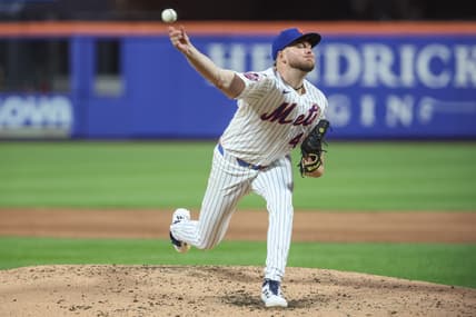 Christian Scott pitches for the Mets against the Marlins