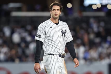 Spencer Jones stands on the field for the Yankees against Toronto