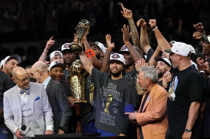 Jalen Brunson holding the Finals MVP trophy for the Knicks