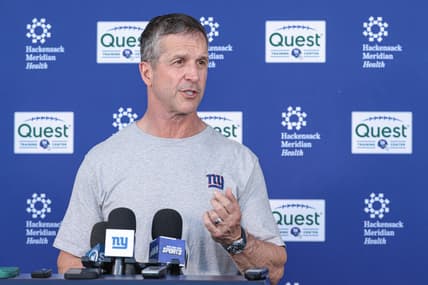 John Harbaugh speaks with reporters after Giants organized team activities
