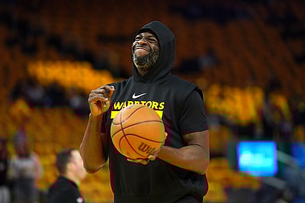 May 12, 2025; San Francisco, California, USA; Golden State Warriors forward Draymond Green (23) holds onto the ball during warmups against the Minnesota Timberwolves during game four of the second round for the 2025 NBA Playoffs at Chase Center. Mandatory Credit: Cary Edmondson-Imagn Images