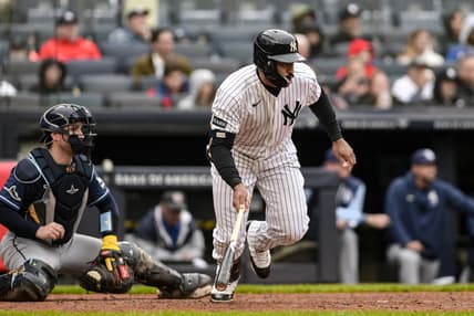 Trent Grisham hits a single for the Yankees against the Rays