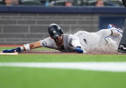José Caballero scores a run for the Yankees in Toronto