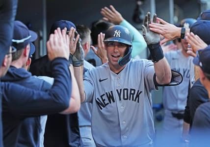 Paul Goldschmidt celebrates in the Yankees dugout after a home run