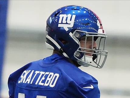 A Giants running back works through drills at rookie minicamp