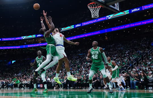 Oct 22, 2024; Boston, Massachusetts, USA; New York Knicks center Jericho Sims (20) and Boston Celtics guard Jaylen Brown (7) work for the ball in the second half at TD Garden. Mandatory Credit: David Butler II-Imagn Images