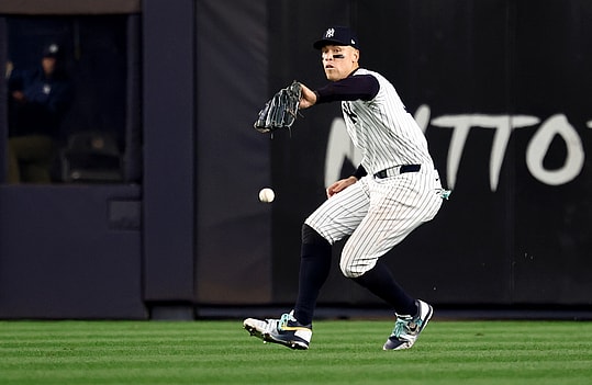 Oct 30, 2024; New York, New York, USA; New York Yankees outfielder Aaron Judge (99) makes a fielding error during the fifth inning against the Los Angeles Dodgers in game five of the 2024 MLB World Series at Yankee Stadium. Mandatory Credit: Vincent Carchietta-Imagn Images