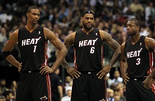 Nov 27, 2010; Dallas, TX, USA; Miami Heat forward Chris Bosh (1) Lebron James (6) guard Dwyane Wade during a break in the action from the game against the Dallas Mavericks at American Airlines Center. The Mavs beat the Heat 106-95. Mandatory Credit: Matthew Emmons-Imagn Images