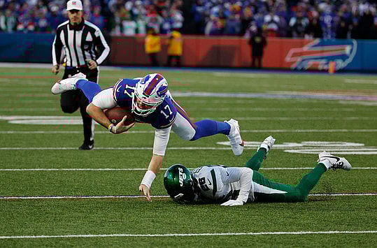 Buffalo Bills quarterback Josh Allen (17) is tackled by New York Jets running back Israel Abanikanda (25) after a short gain. Credit:Jamie Germano/Rochester Democrat and Chronicle / USA TODAY NETWORK