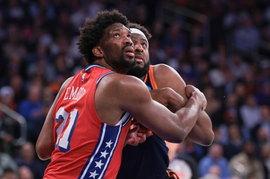 Apr 22, 2024; New York, New York, USA;  Philadelphia 76ers center Joel Embiid (21) battles for position against New York Knicks center Mitchell Robinson (23) during the second half during game two of the first round for the 2024 NBA playoffs at Madison Square Garden. Mandatory Credit: Vincent Carchietta-USA TODAY Sports