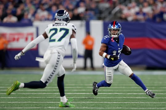 Oct 2, 2023; East Rutherford, New Jersey, USA; New York Giants wide receiver Wan'Dale Robinson (17) runs with the ball against Seattle Seahawks cornerback Riq Woolen (27) during the first quarter at MetLife Stadium. Mandatory Credit: Brad Penner-USA TODAY Sports
