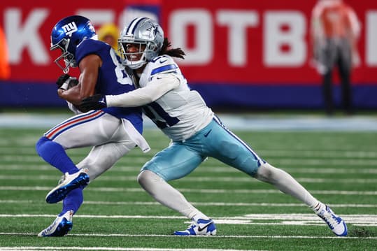 Sep 10, 2023; East Rutherford, New Jersey, USA; Dallas Cowboys cornerback Stephon Gilmore (21) tackles New York Giants wide receiver Darius Slayton (86) during the second half at MetLife Stadium. Mandatory Credit: Ed Mulholland-USA TODAY Sports