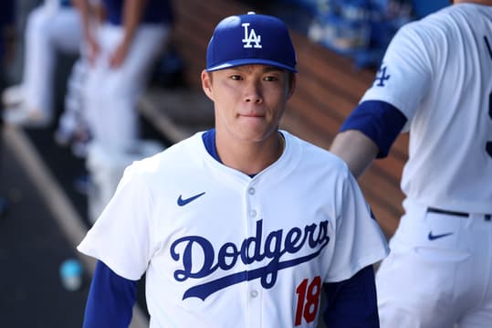 Sep 22, 2024; Los Angeles, California, USA; Los Angeles Dodgers starting pitcher Yoshinobu Yamamoto (18) walks in the dugout during the third inning against the Colorado Rockies at Dodger Stadium. Mandatory Credit: Kiyoshi Mio-Imagn Images