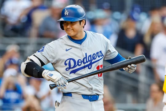 Jul 30, 2024; San Diego, California, USA; Los Angeles Dodgers designated hitter Shohei Ohtani (17) looks into the San Diego Padres dugout before his at bat during the first inning at Petco Park. Mandatory Credit: David Frerker-Imagn Images