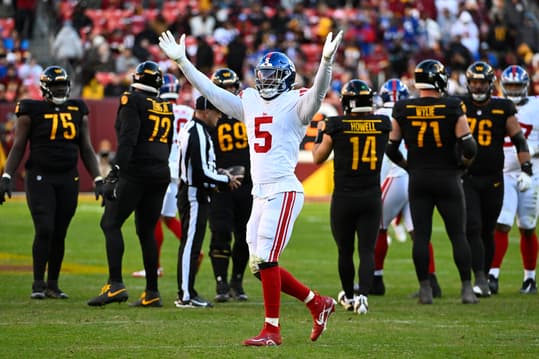 Nov 19, 2023; Landover, Maryland, USA; New York Giants linebacker Kayvon Thibodeaux (5) celebrate after a sack against the Washington Commandersduring the second half at FedExField. Mandatory Credit: Brad Mills-Imagn Images