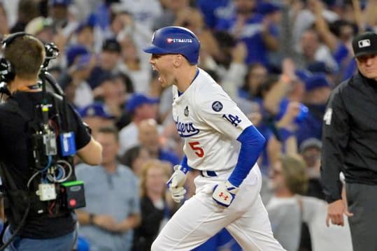 Oct 26, 2024; Los Angeles, California, USA; Los Angeles Dodgers first baseman Freddie Freeman (5) reacts after hitting a solo home run in the third inning against the New York Yankees during game two of the 2024 MLB World Series at Dodger Stadium. Mandatory Credit: Jayne Kamin-Oncea-Imagn Images