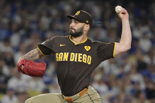 Oct 6, 2024; Los Angeles, California, USA; San Diego Padres pitcher Tanner Scott (66) pitches against the Los Angeles Dodgers in the eighth inning during game two of the NLDS for the 2024 MLB Playoffs at Dodger Stadium. Mandatory Credit: Jayne Kamin-Oncea-Imagn Images
