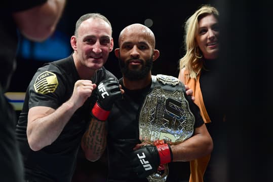 Apr 15, 2017; Kansas City, MO, USA; Demetrious Johnson (Red Gloves) following the win over and Wilson Reis (not pictured) during UFC Fight Night at Sprint Center. Mandatory Credit: Ron Chenoy-Imagn Images