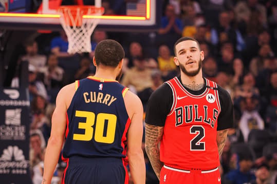 Jan 23, 2025; San Francisco, California, USA; Golden State Warriors guard Stephen Curry (30) walks around Chicago Bulls guard Lonzo Ball (2) after missing a half court shot at the buzzer of the first quarter at Chase Center. Mandatory Credit: Kelley L Cox-Imagn Images